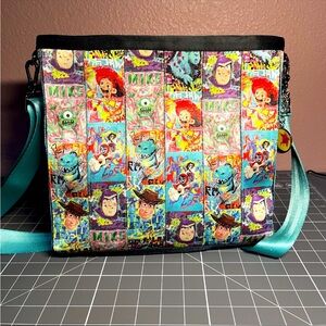 2024 Disney Parks Harvey’s Pixar Fest Painted Vertical Crossbody Backpack